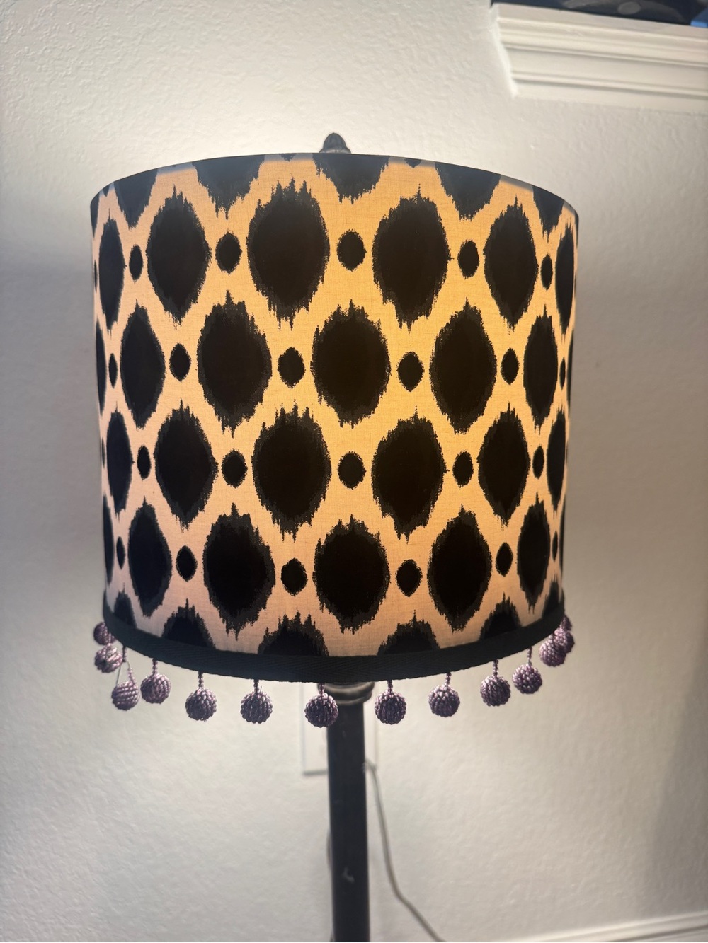 Black and off white Ikat patterned lamp shade with beaded pom pom trim